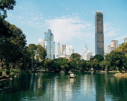 A peaceful view of a park in Bangkok city during afternoon